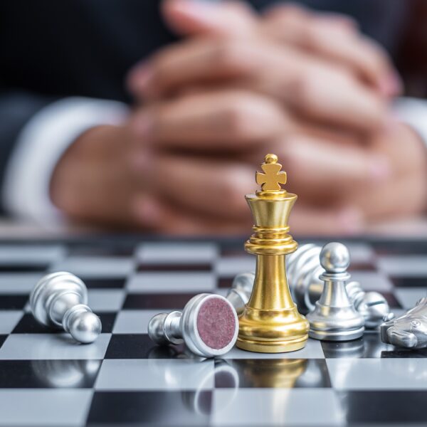 chess-king-figure-against-chessboard-opponent