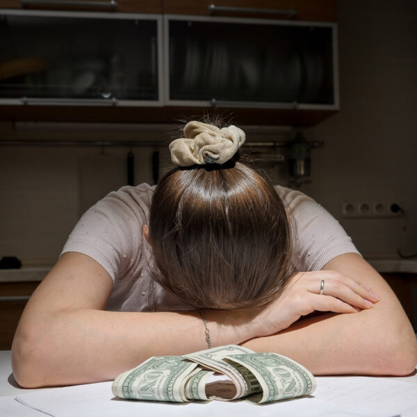 stressed-woman-having-to-pay-rent-and-bank-loan