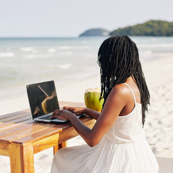 woman-working-remotely-from-beach