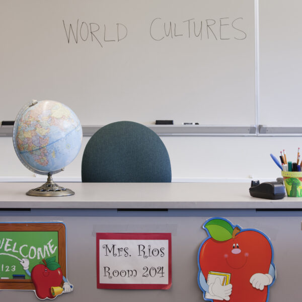 empty-desk-of-teacher-in-classroom